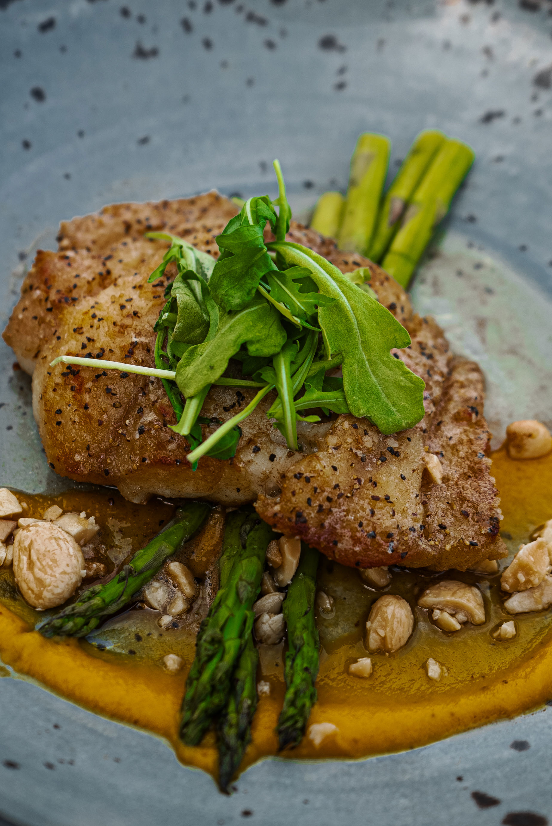 Pan-roasted local catch with asparagus